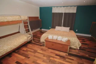 Spacious bedroom with bunk beds and double bed
