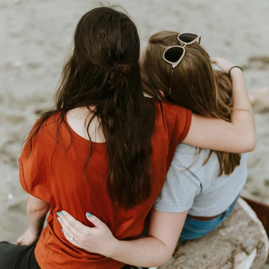 Two people embracing on a beach