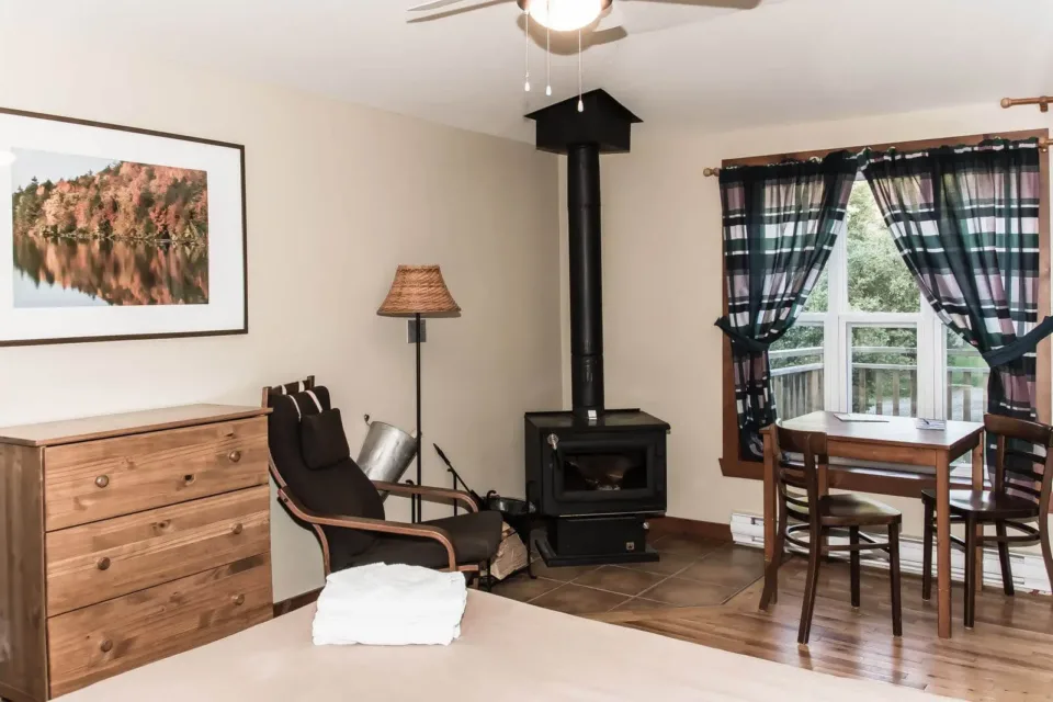 Cozy room with wood stove and dining table