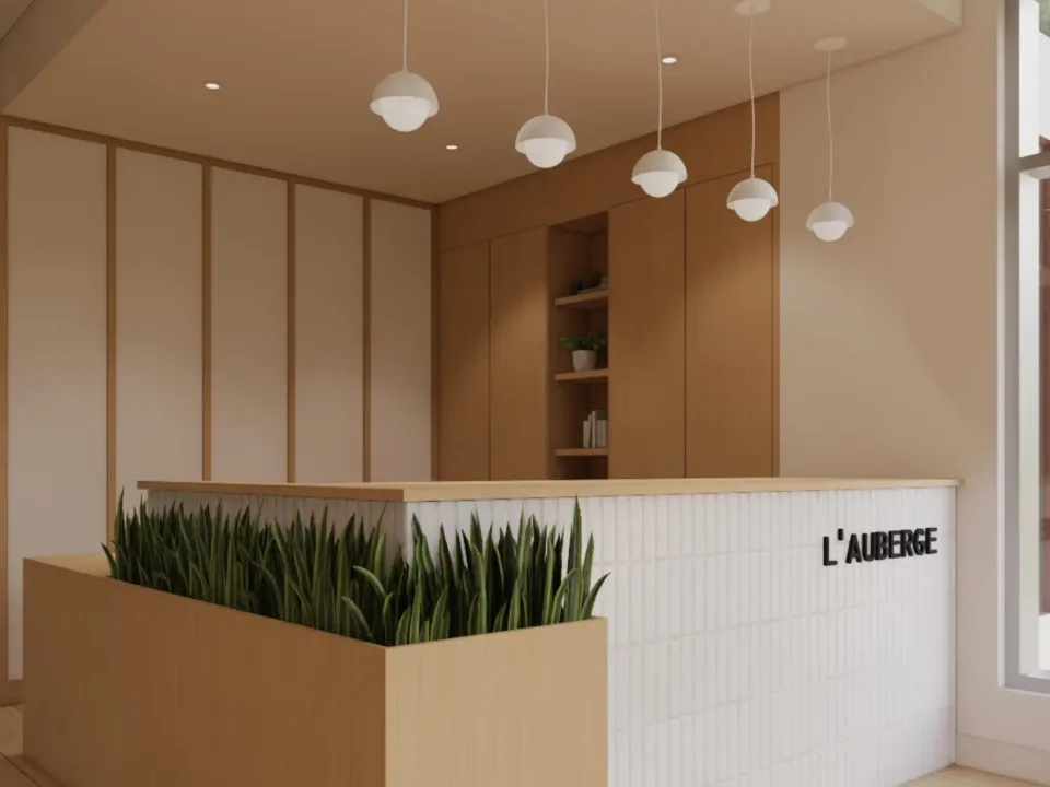 Modern wooden reception with 'L'Auberge' sign