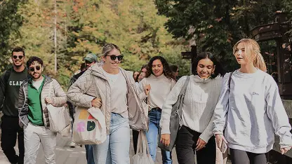Group of friends walking outdoors in park
